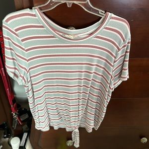 Pink, blue, and white striped shirt. Size is XL although they run small.